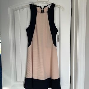 New with tags. Black and blush dress. Size medium.